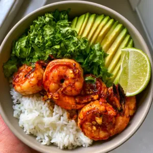 Succulent pink-orange seared shrimp with charred edges and a glossy chili lime glaze in a ceramic bowl. (Chili Lime Shrimp Bowls)