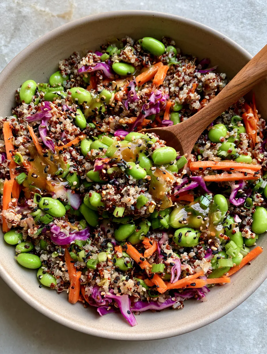 Quinoa Edamame Salad with Ginger Soy Dressing (Vibrant & Protein-Packed) 4 Top-down view of an Asian quinoa edamame salad with matchstick carrots and toasted black sesame seeds. (quinoa edamame salad)